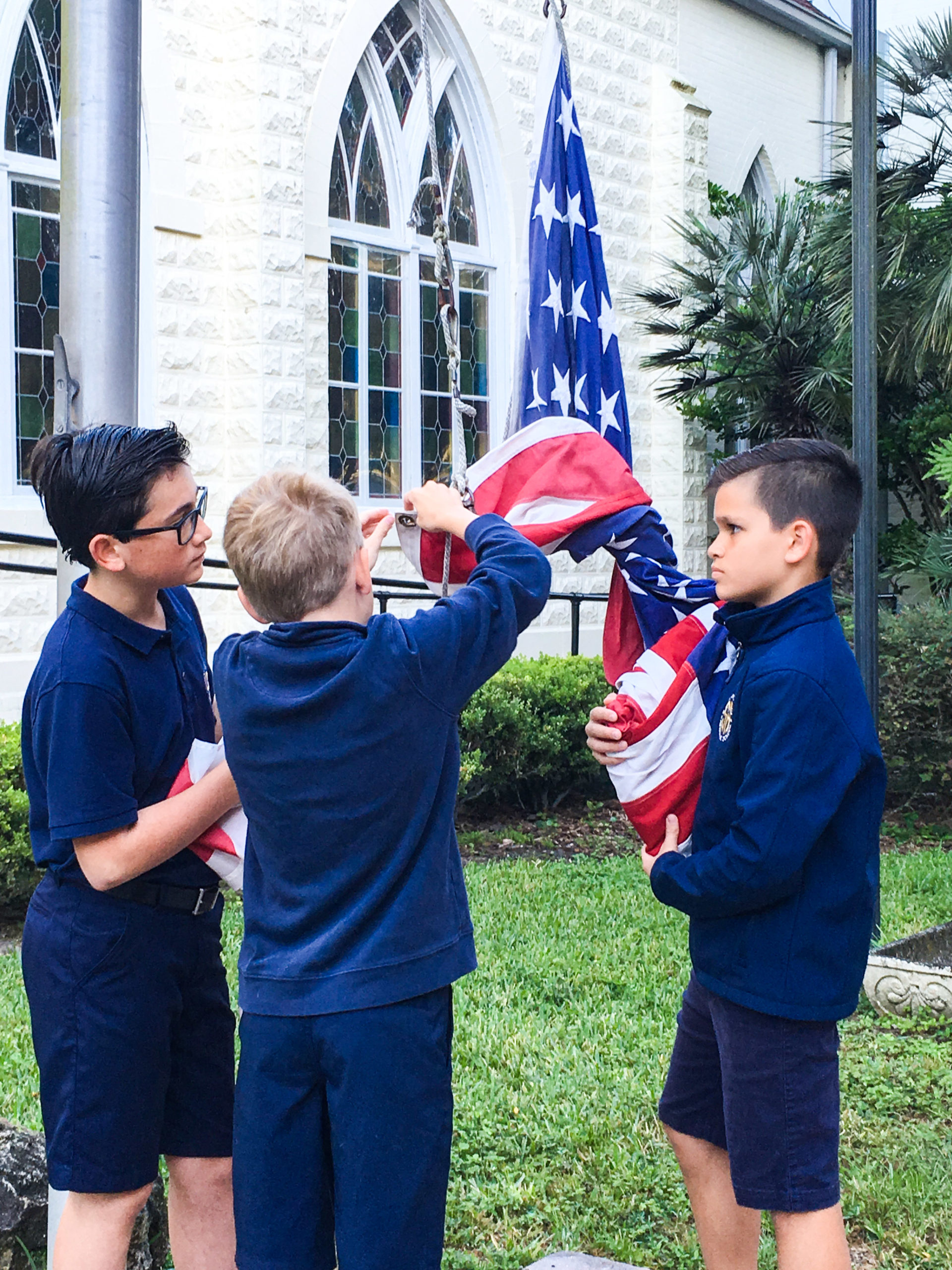 Boys-raising-flag